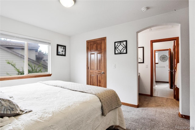 9644 S Estes Way, Littleton, CO 80127 - bedroom featuring arched walkways and carpet