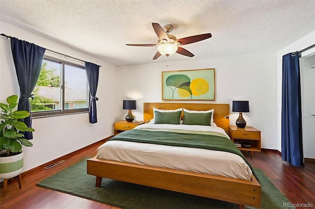9125 Lowell Ct, Westminster, CO 80031 - bedroom with wood finished floors, a textured ceiling, and a ceiling fan