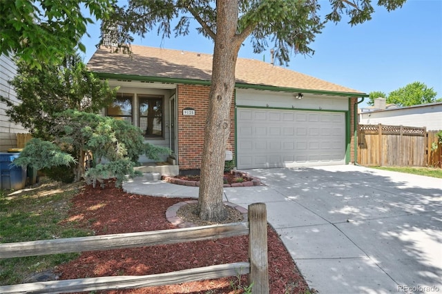 9125 Lowell Ct, Westminster, CO 80031 - ranch-style house with concrete driveway, an attached garage, brick siding, and roof with shingles