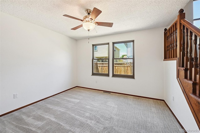 9125 Lowell Ct, Westminster, CO 80031 - unfurnished room featuring a ceiling fan, carpet flooring, a textured ceiling, and stairs