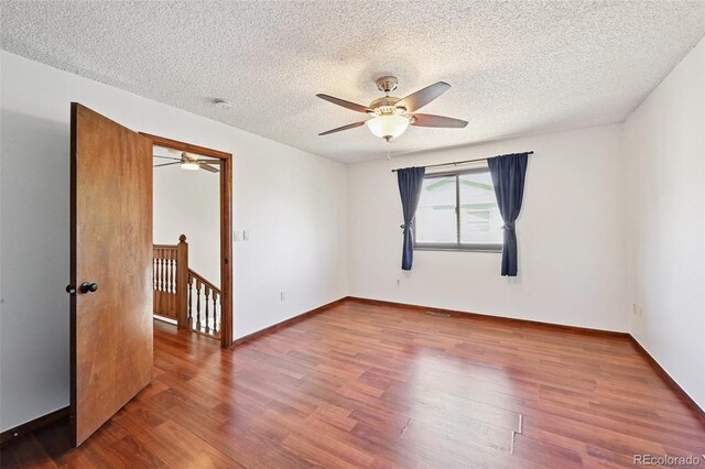 9125 Lowell Ct, Westminster, CO 80031 - spare room featuring a ceiling fan, wood finished floors, and a textured ceiling