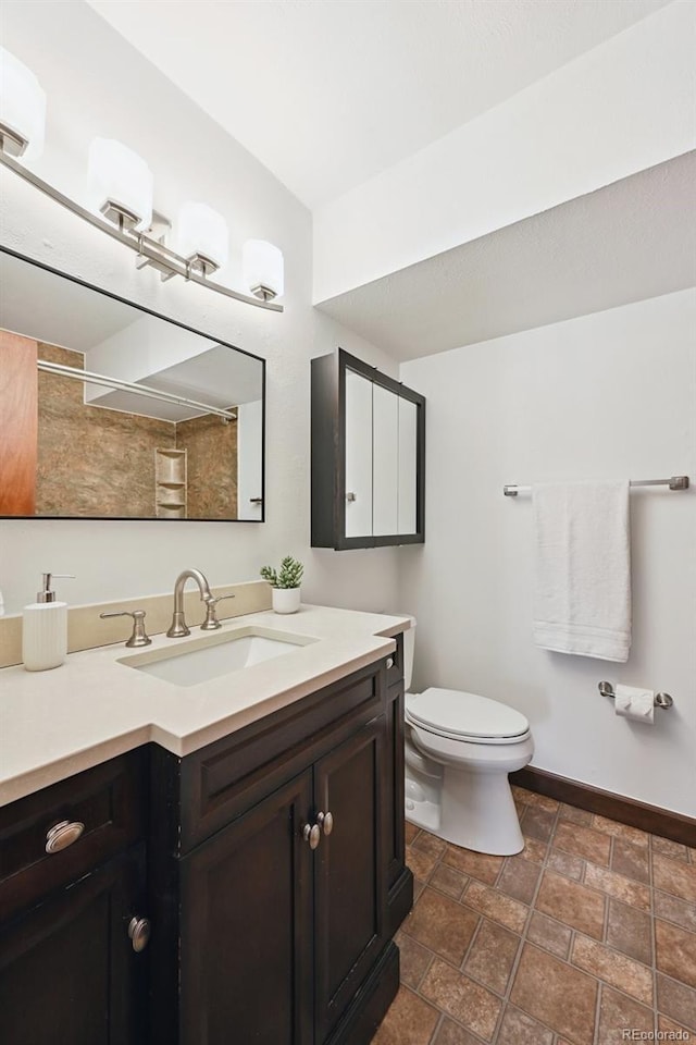 9125 Lowell Ct, Westminster, CO 80031 - full bathroom with vanity, stone finish floors, and a shower