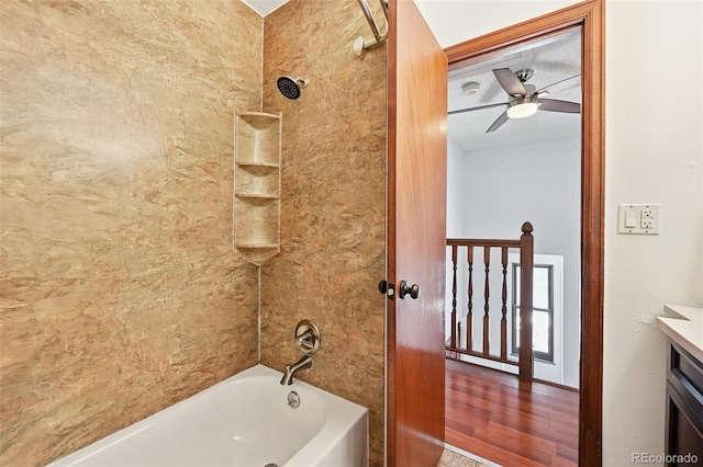 9125 Lowell Ct, Westminster, CO 80031 - bathroom featuring a ceiling fan, tub / shower combination, vanity, and wood finished floors