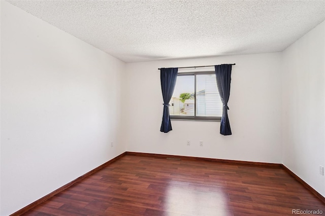 9125 Lowell Ct, Westminster, CO 80031 - empty room with wood finished floors and a textured ceiling