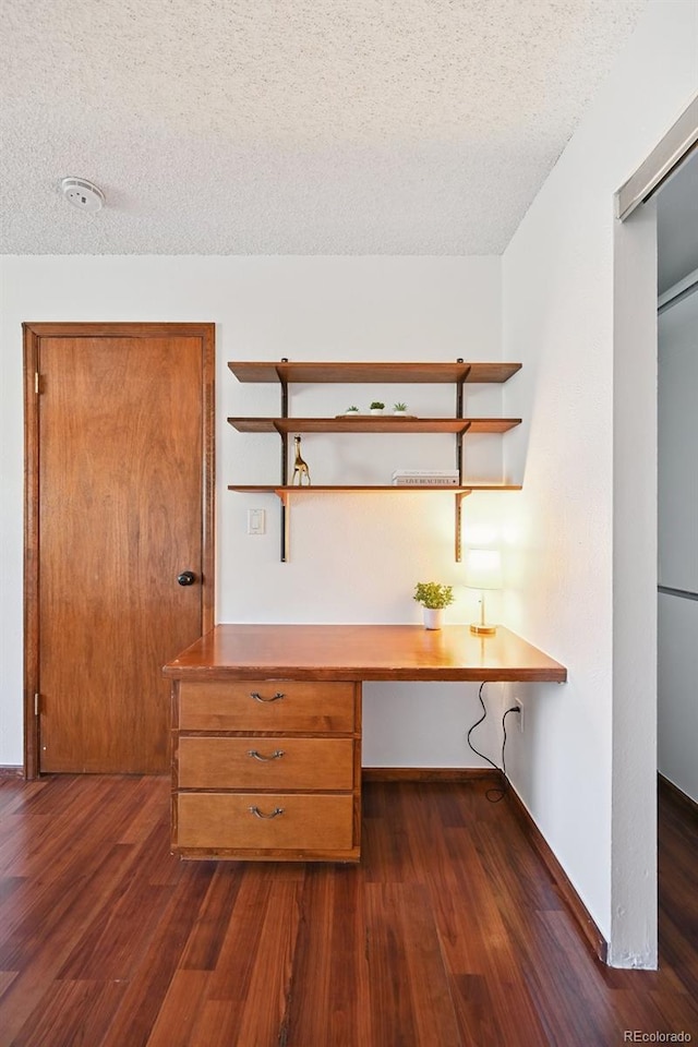9125 Lowell Ct, Westminster, CO 80031 - unfurnished office with a textured ceiling, dark wood-style flooring, and built in study area