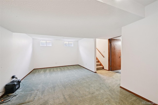 9125 Lowell Ct, Westminster, CO 80031 - additional living space with carpet floors, stairway, and a textured ceiling