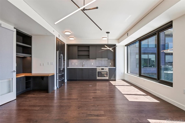 1750 Wewatta St Unit 1102, Denver, CO 80202 - kitchen with high end fridge, open shelves, oven, dark wood-style floors, and tasteful backsplash