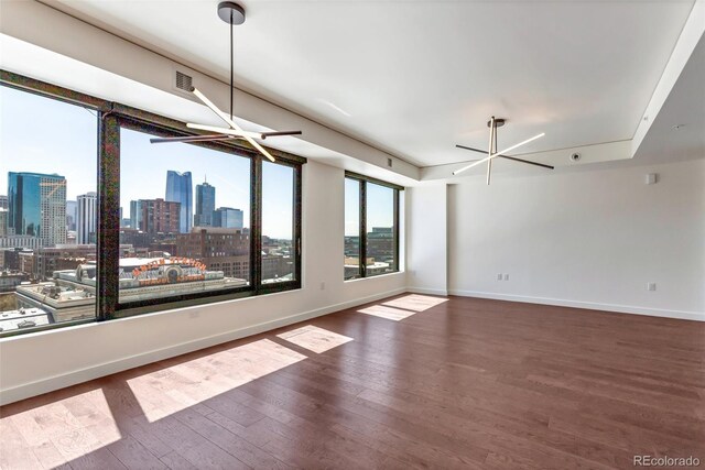 1750 Wewatta St Unit 1102, Denver, CO 80202 - spare room with a view of skyline and wood finished floors