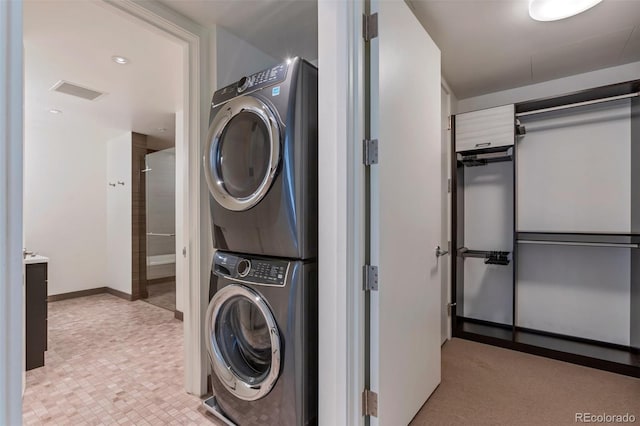 1750 Wewatta St Unit 1102, Denver, CO 80202 - laundry room featuring stacked washer / dryer