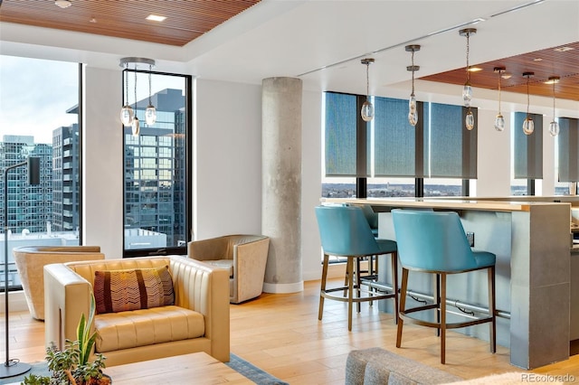 1750 Wewatta St Unit 1102, Denver, CO 80202 - interior space featuring a tray ceiling, light wood finished floors, recessed lighting, and a city view