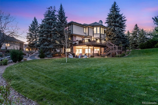 9980 Newton Ct, Westminster, CO 80031 - back of house featuring a yard, a chimney, a wooden deck, and stairs