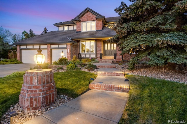 9980 Newton Ct, Westminster, CO 80031 - view of front of property featuring brick siding, a tile roof, concrete driveway, a garage, and a front lawn