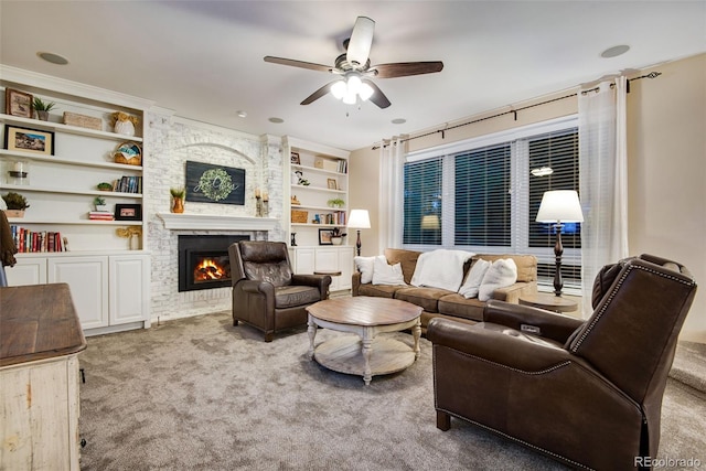 9980 Newton Ct, Westminster, CO 80031 - carpeted living area with a fireplace, a ceiling fan, and built in shelves