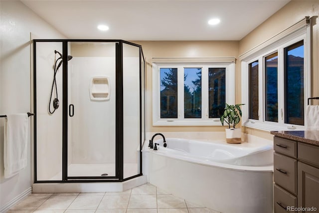 9980 Newton Ct, Westminster, CO 80031 - bathroom featuring vanity, recessed lighting, a stall shower, tile patterned flooring, and a garden tub