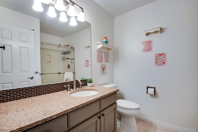 9980 Newton Ct, Westminster, CO 80031 - bathroom featuring a stall shower, baseboards, toilet, tile patterned floors, and vanity