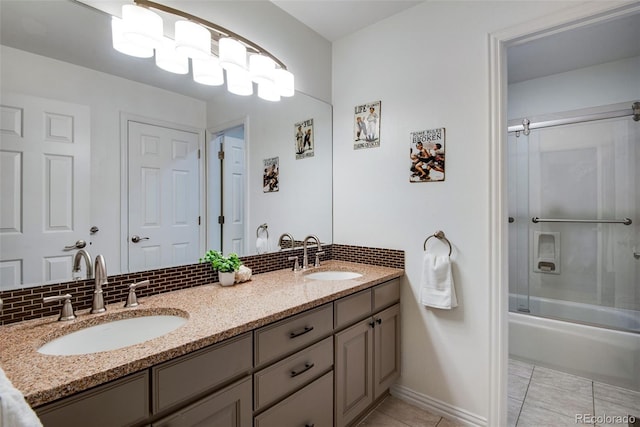 9980 Newton Ct, Westminster, CO 80031 - bathroom with a sink, double vanity, combined bath / shower with glass door, and decorative backsplash