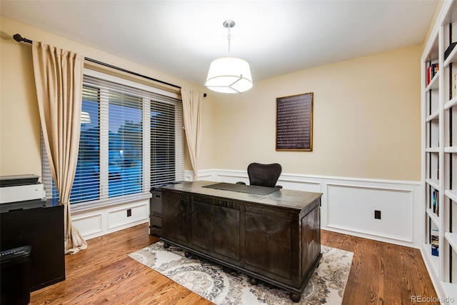 9980 Newton Ct, Westminster, CO 80031 - office area with a decorative wall, a wainscoted wall, and wood finished floors