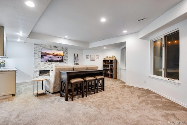 9980 Newton Ct, Westminster, CO 80031 - bar featuring a stone fireplace, recessed lighting, visible vents, and light colored carpet