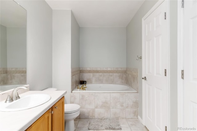 bathroom featuring tile patterned floors, vanity, toilet, and a bath