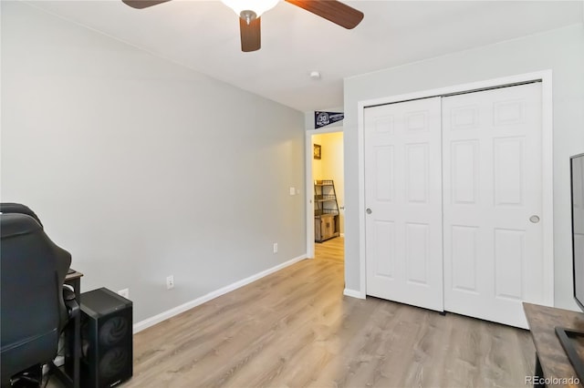 office with ceiling fan, baseboards, and light wood finished floors