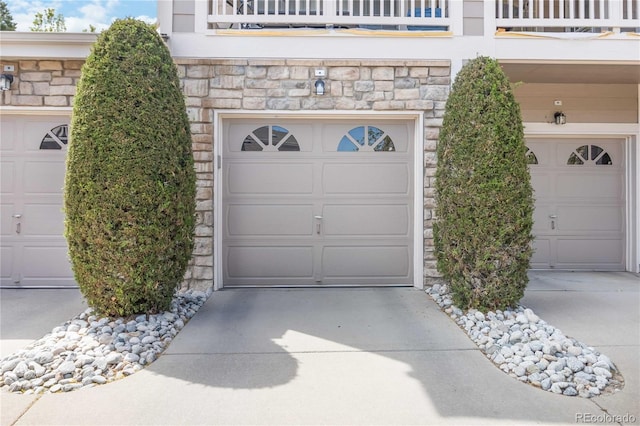 garage with concrete driveway