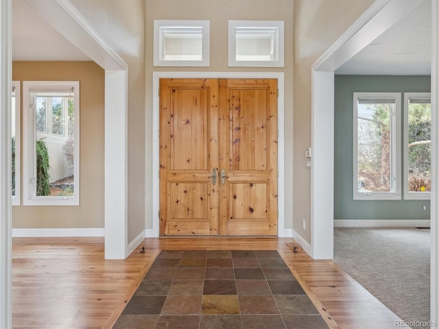 902 Anaconda Ct, Castle Rock, CO 80108 - foyer entrance featuring baseboards and wood finished floors