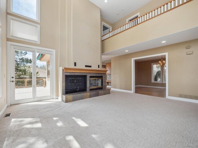 902 Anaconda Ct, Castle Rock, CO 80108 - unfurnished living room with baseboards, a chandelier, visible vents, and carpet floors