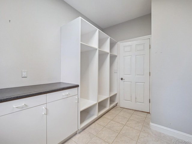 902 Anaconda Ct, Castle Rock, CO 80108 - mudroom featuring light tile patterned floors and baseboards