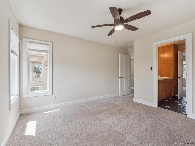 902 Anaconda Ct, Castle Rock, CO 80108 - unfurnished bedroom with ensuite bath, ceiling fan, carpet flooring, and baseboards