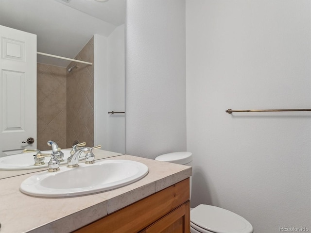 902 Anaconda Ct, Castle Rock, CO 80108 - bathroom featuring walk in shower, vanity, and toilet