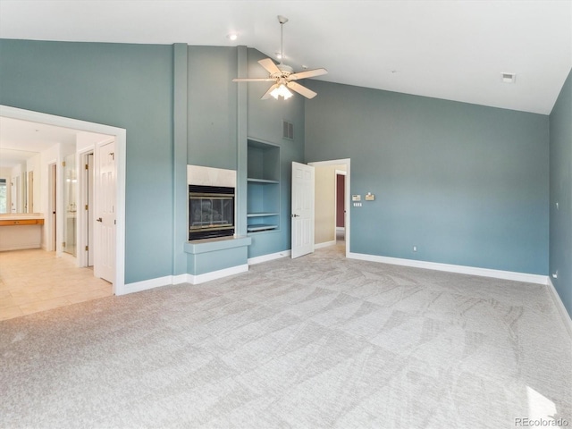902 Anaconda Ct, Castle Rock, CO 80108 - unfurnished living room featuring carpet, high vaulted ceiling, visible vents, a fireplace, and ceiling fan