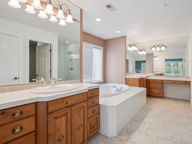 902 Anaconda Ct, Castle Rock, CO 80108 - bathroom featuring a sink, a bath, visible vents, tile patterned flooring, and a shower stall