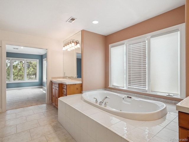 902 Anaconda Ct, Castle Rock, CO 80108 - full bathroom featuring vanity, visible vents, recessed lighting, tile patterned floors, and a jetted tub