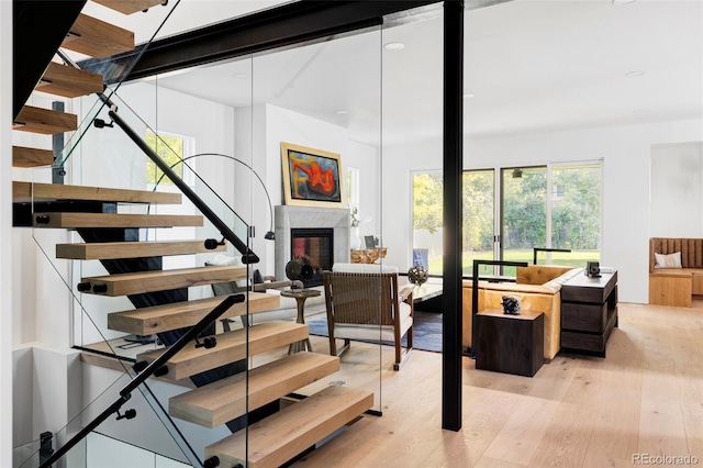 stairway with hardwood / wood-style flooring