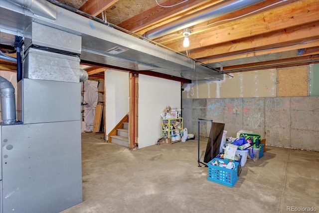 basement featuring heating unit