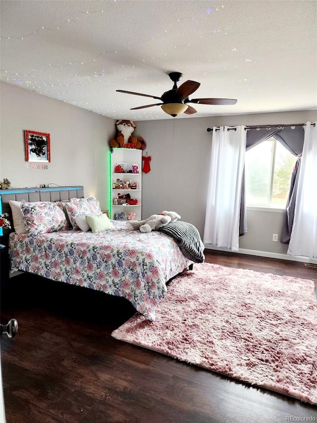 bedroom with wood finished floors and a ceiling fan