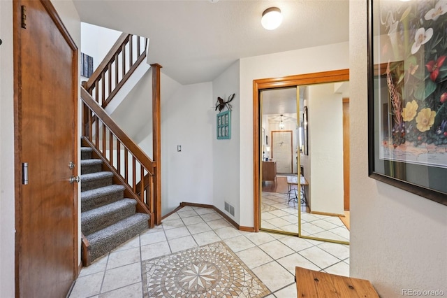 foyer with light tile patterned flooring