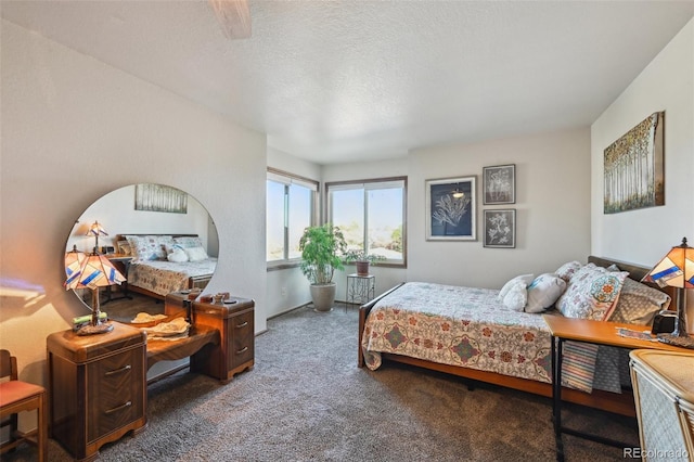 carpeted bedroom featuring a textured ceiling