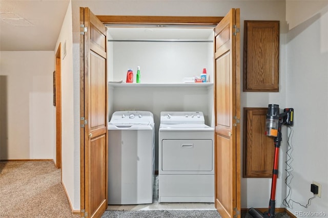 laundry room with light colored carpet and washing machine and clothes dryer