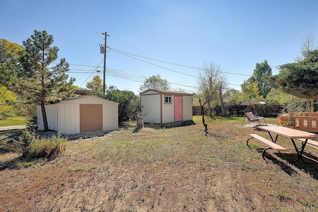 view of yard with a storage unit