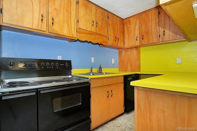 kitchen with sink and black appliances