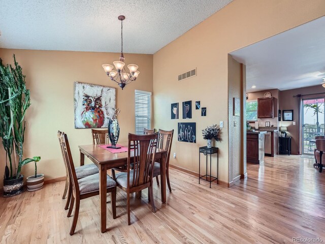 3691 Bucknell Dr, Highlands Ranch, CO 80129 - dining room featuring light wood-type flooring and a chandelier