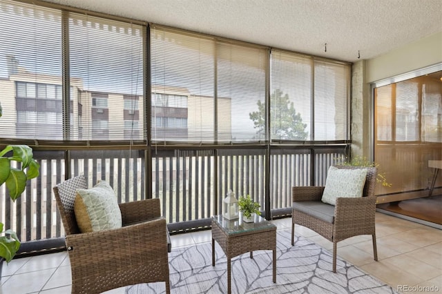 sunroom featuring a baseboard heating unit