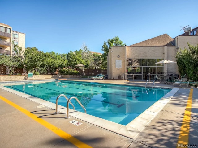 view of swimming pool with a patio area