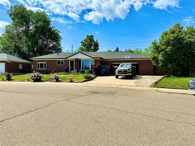 10425 Franklin Way, Northglenn, CO 80233 - single story home with driveway, an attached garage, brick siding, and a front yard