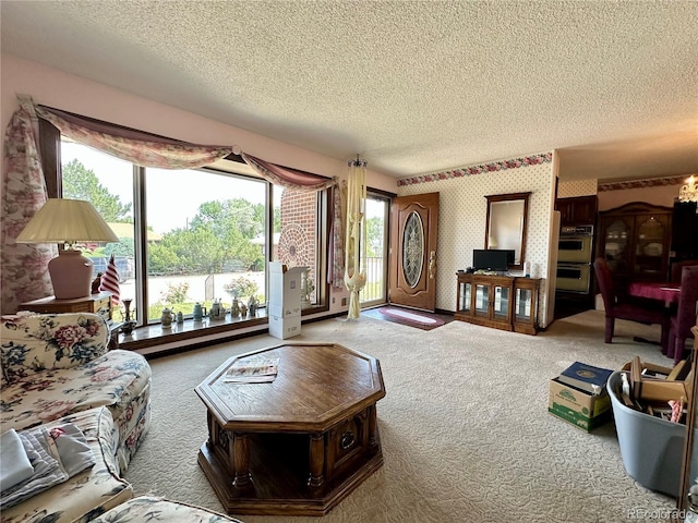 10425 Franklin Way, Northglenn, CO 80233 - living room with carpet floors, a textured ceiling, and wallpapered walls