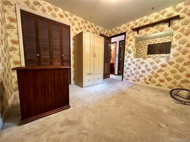 10425 Franklin Way, Northglenn, CO 80233 - unfurnished bedroom with wallpapered walls, carpet, and multiple closets