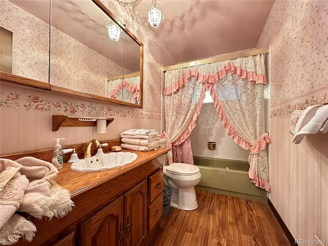 10425 Franklin Way, Northglenn, CO 80233 - bathroom with wallpapered walls, wood finished floors, shower / tub combo with curtain, vanity, and vaulted ceiling