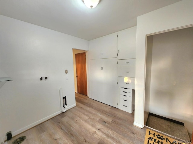 18 Columbia Dr, Julesburg, CO 80737 - unfurnished bedroom with light wood-style flooring and baseboards