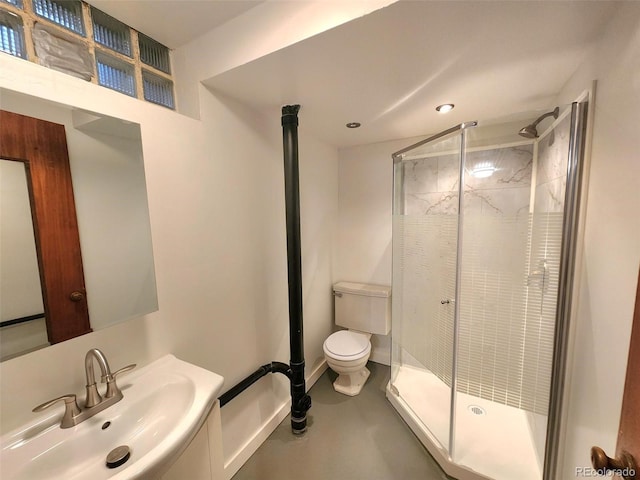 18 Columbia Dr, Julesburg, CO 80737 - full bath featuring toilet, a stall shower, concrete flooring, recessed lighting, and vanity